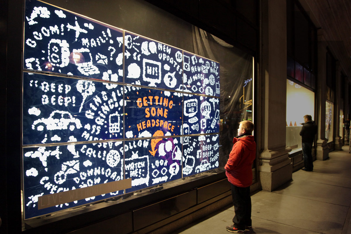 A passer-by experiencing the No Noise installation at Selfridges on Oxford Street